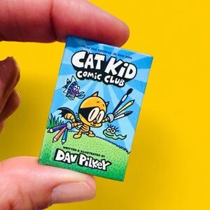 Zuru Mini Brands Book: Cat Kid Comic 
Club Hardcover Book